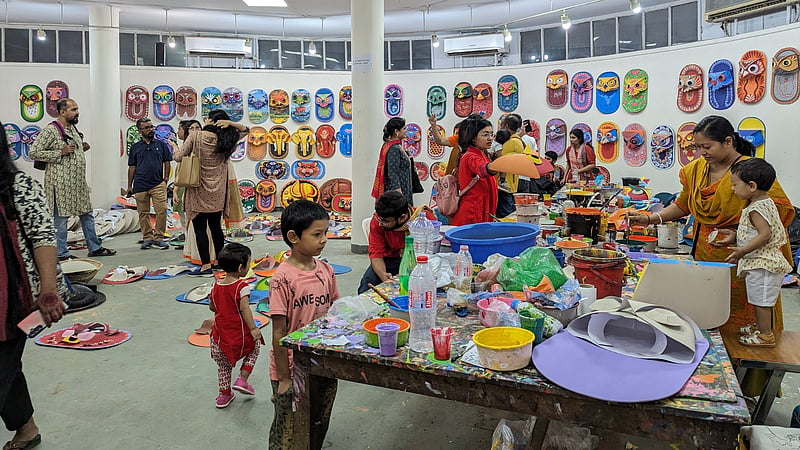 Children observe the preparations for the Mangal Shobhajatra procession at the Dhaka University Faculty of Fine Art.