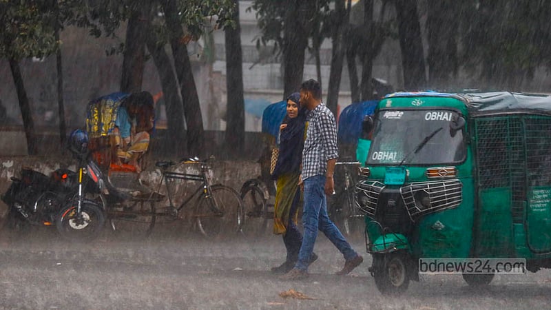 Some enjoyed a brief spell of rain amid a heatwave in the TSC area of Dhaka University on Tuesday, Apr 16, 2024.