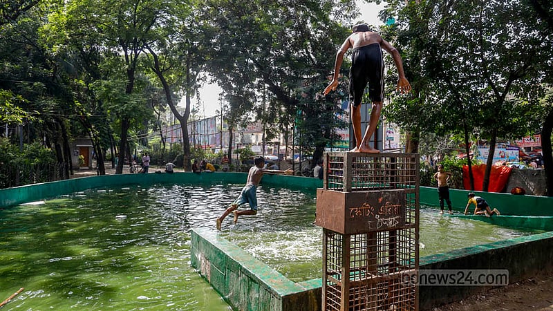 The children’s skating area in Lalmatia’s Trikon Park has turned into a pool, where teenagers are now playing in the water. Photo: Mahmud Zaman Ovi