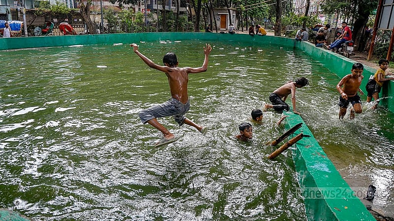The children’s skating area in Lalmatia’s Trikon Park has turned into a pool, where teenagers are now playing in the water. Photo: Mahmud Zaman Ovi