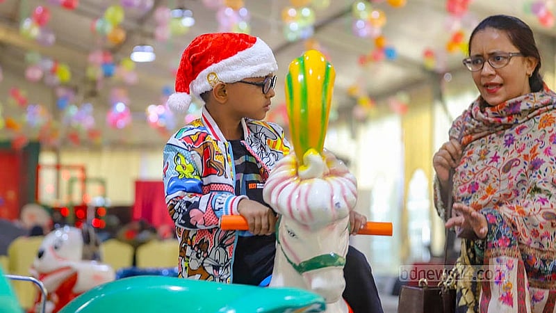 Many people attend the Christmas celebrations at the Pan Pacific Sonargaon Hotel in Dhaka with their children. Photo: Abdullah al Momin