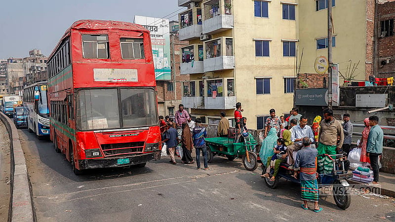 Babu Bazar Bridge, a key crossing over the Buriganga River, has become synonymous with suffering, as vehicles are forced to wait for long periods due to buses repeatedly stopping on the bridge to pick up passengers. Photo: Mahmud Zaman Ovi