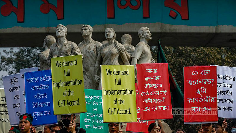 Students from ethnic minority groups gathered at the foot of the Raju Memorial Sculpture at Dhaka University on Wednesday, Jan 15, 2025, holding banners to protest the removal of images featuring the word “adivasi” – a collective term for a number of ethnic minority groups in Bangladesh – from textbooks. Photo: Mahmud Zaman Ovi