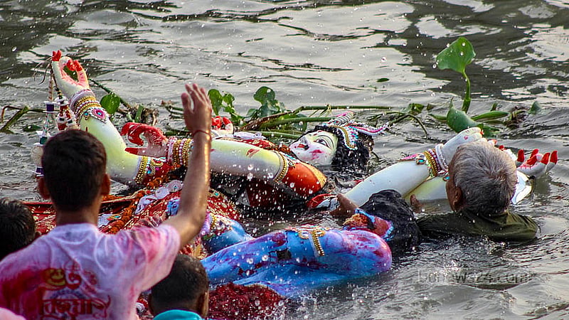 Hindu devotees say farewell to the goddess for the destruction of evil forces at Buriganga River in Dhaka’s Bosila. Through the immersion, the wait for another year for the arrival of the goddess began. Photo: Shamim-Us-Salehin