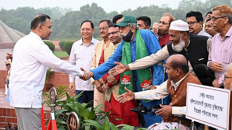 Prime Minister Tarique Rahman exchanges greetings with freedom fighters at the National Memorial in Savar on Thursday, Mar 26, 2026. Photo: PID