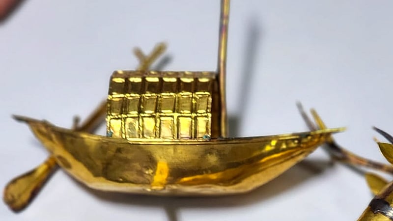 A gold boat figurine was discovered among the assets in the locker.