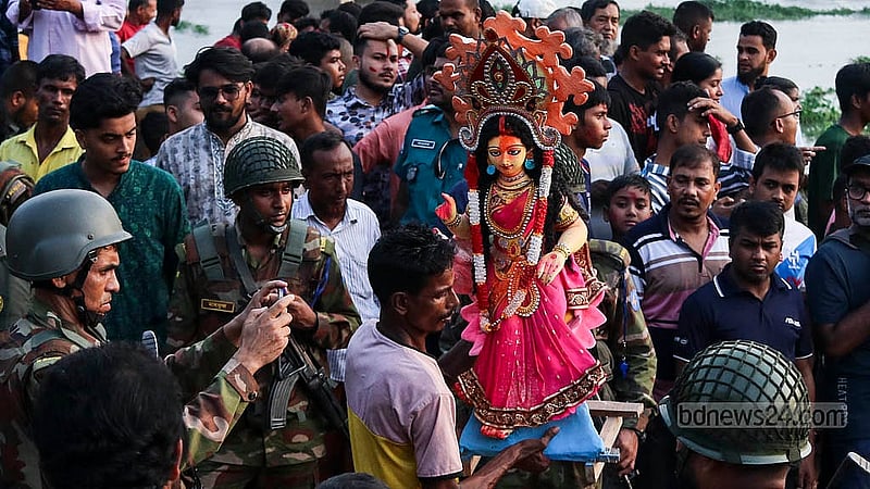 Army personnel strictly monitor the designated spot for idol immersion at Buriganga River in Dhaka’s Bosila on Sunday, Oct 13, 2024. Photo: Shamim-Us-Salehin