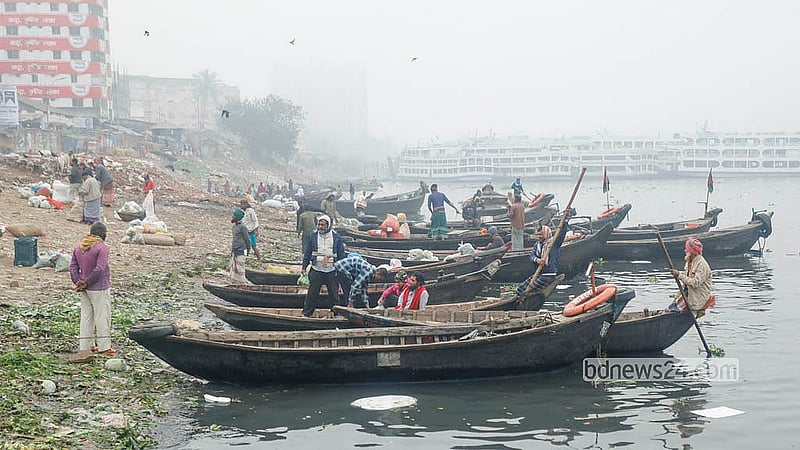 Boatmen wait for passengers along the banks of the Buriganga River at Sadarghat on a winter morning. Photo: Abdullah al Momin