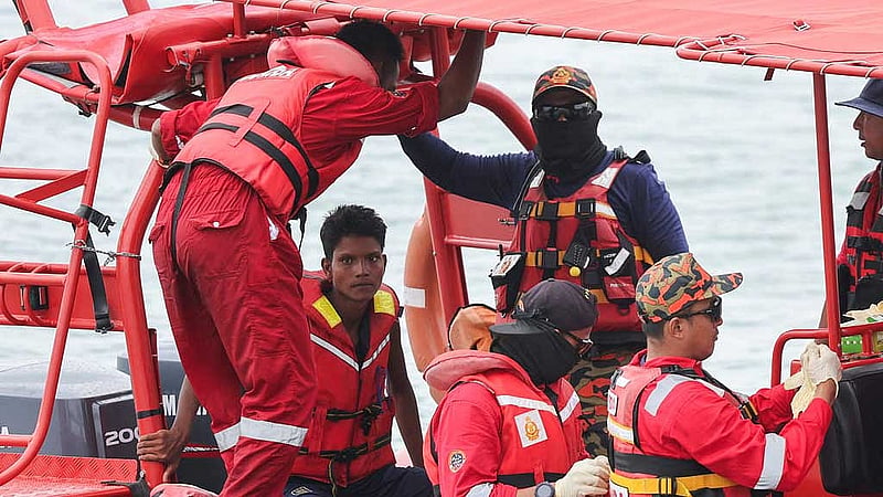 Iman Sharif, 18, a survivor from a boat carrying members of Myanmar's persecuted Rohingya community, which sank in waters near the Thailand–Malaysia border, is brought to the rescue operations centre six days after the incident, at Langkawi, Malaysia, Nov 11, 2025. REUTERS/Hasnoor Hussain