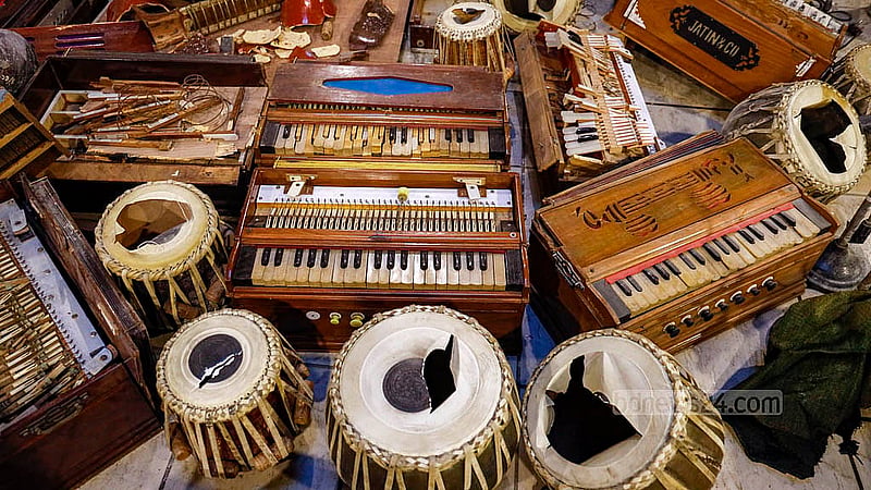 Destroyed musical instruments have been placed near the entrance inside Chhayanaut following the attack on Dec 18, 2025. Photo: Mahmud Zaman Ovi