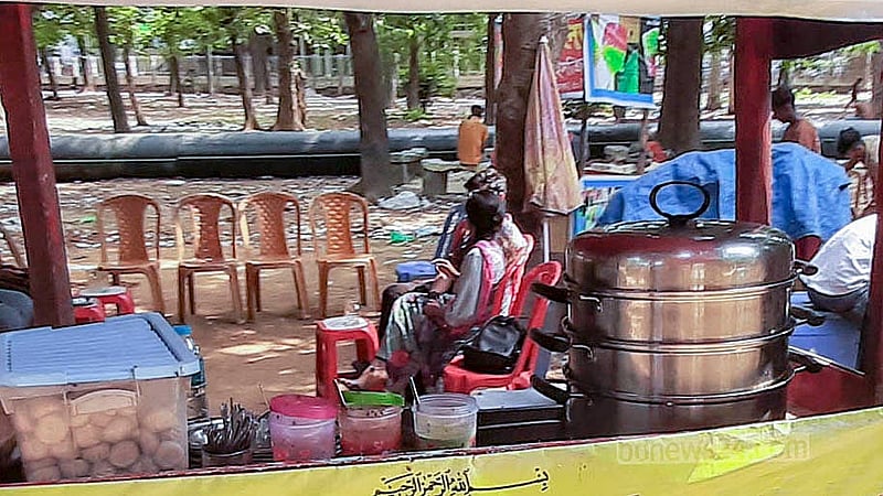 A pot full of momo sits at a stall in Suhrawardy Udyan. Both the preparation of food and cleaning of utensils involve the use of the dirty pond water. Photo: Abdullah al Momin