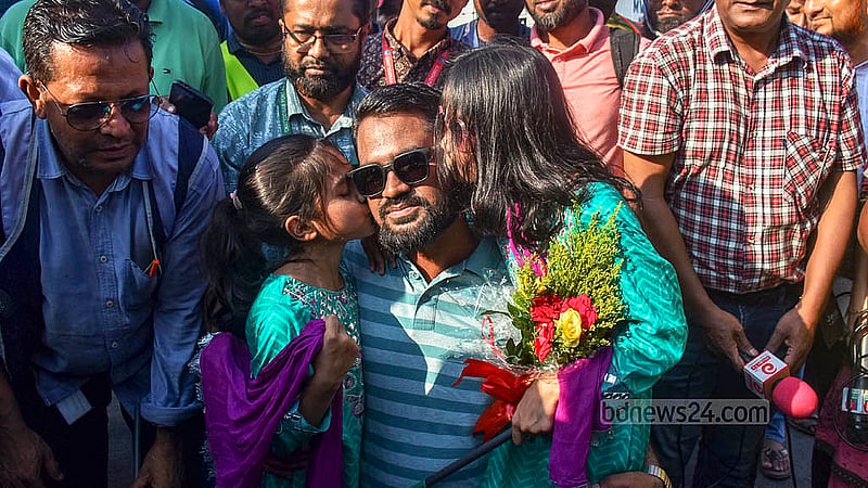 MV Abdullah’s Chief Officer Atiqullah Khan hugs his children as he arrives in Chattogram Port on Tuesday, May 14, 2024. He was among 23 crew members who were freed by Somali pirates after over a month in captivity.