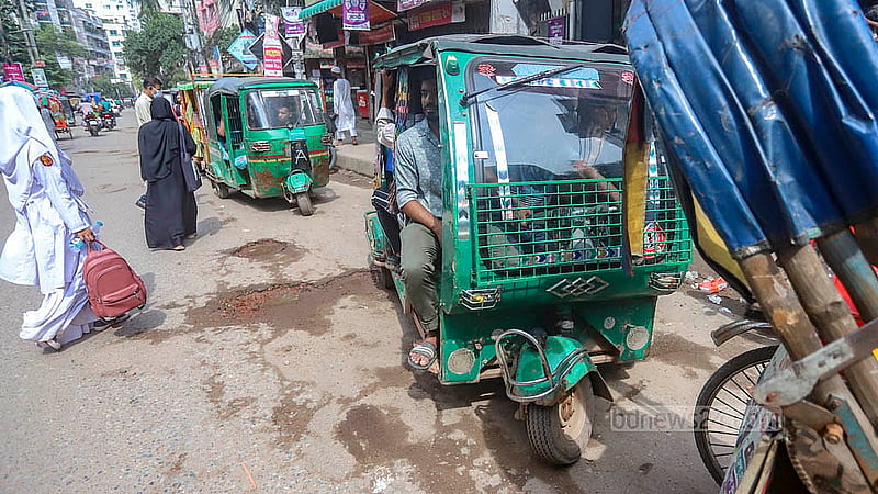 The frame of an old autorickshaw has been cut down and formed into a larger, makeshift autorickshaw. This unfit three-wheeler runs on gas. Photo: Abdullah Al Momin