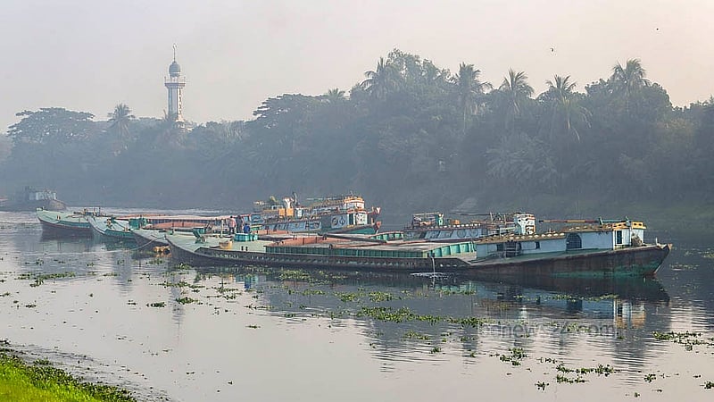 A sand-laden bulkhead gets stranded on a submerged char in the Balu River at Bauler Bazar area in Dhaka’s Demra. The photo was taken at 8:00am on Friday, Jan 10, 2025.  Photo: Abdullah al Momin