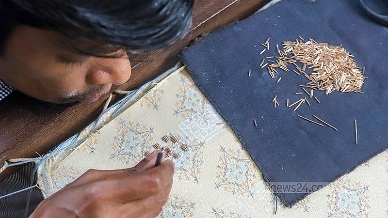 An artisan is fully immersed in embroidery work ahead of Eid-ul-Fitr, a moment captured at Benarasi Palli in Dhaka’s Mirpur. Photo: Abdullah al Momin
