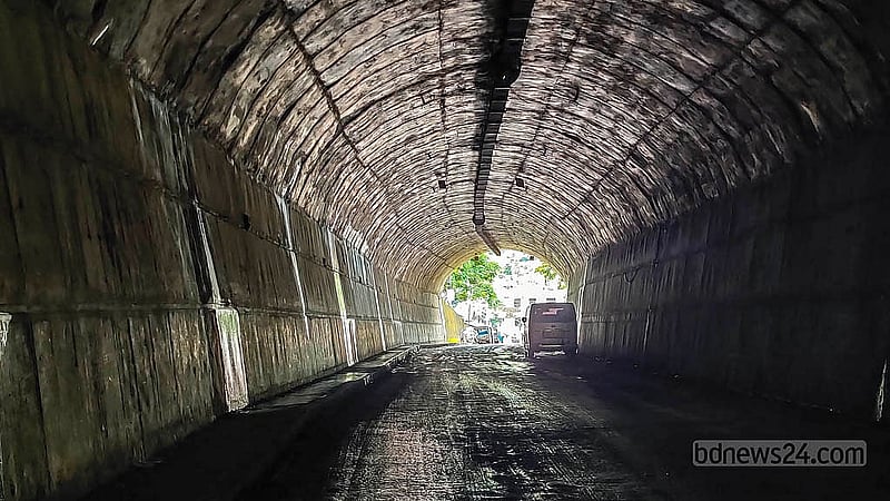 Water dripping from the walls of the Bandarban Bus Terminal Tunnel has created potholes, leaving the interior muddy. Both people and vehicles still struggle to pass through it. Photo: U She Thowai Marma