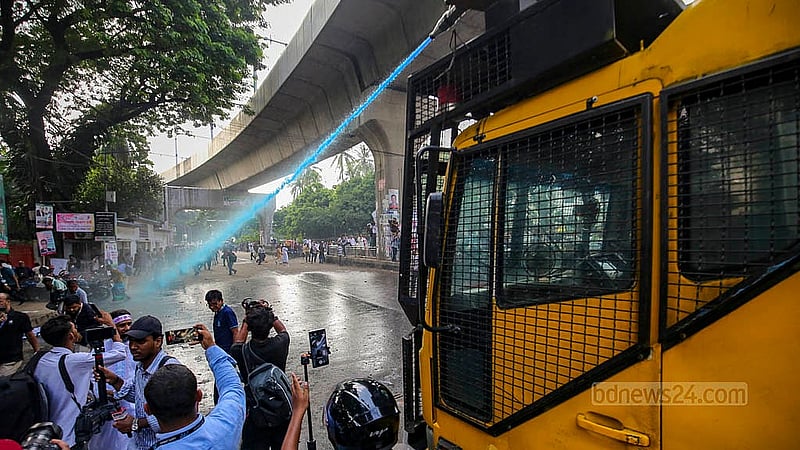 Police use water cannons on Sunday, Oct 12, 2025, to disperse MPO-listed teachers and employees staging a sit-in in front of the National Press Club, demanding higher house rent allowances.