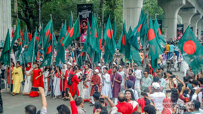 Students carrying the national flag take part in the procession organised by the Faculty of Fine Arts at Dhaka University.  Photo: Abdullah Al Momin