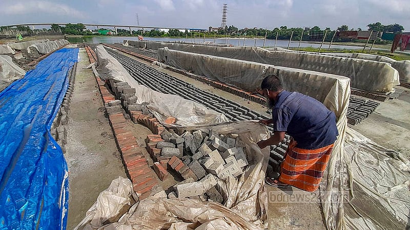 Brick kiln owners in Jajira, South Keraniganj, have suffered major losses due to rain at the beginning of the brick-making season. Over 100 brick kilns operate along the banks of the Dhaleshwari River in the area. Photo: Abdullah Al Momin