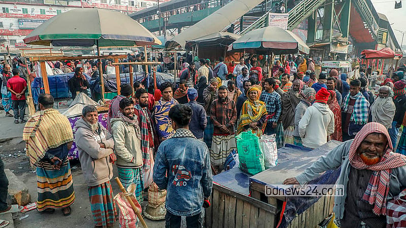 People from different walks of life arrive in groups at the Hemayetpur bus terminal area of Savar before the day breaks, in search of work. Photo: Abdullah Al Momin