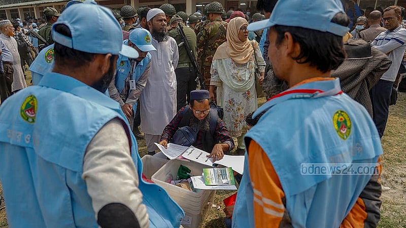 A presiding officer receives election materials for Dhaka 7 at Azimpur Girls’ School and College. Photo: Mahmud Zaman Ovi