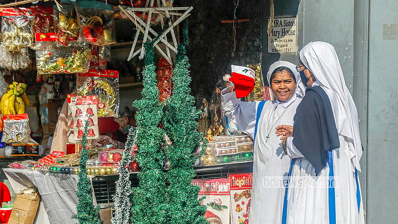 Some people buy Santa Claus costumes outside the Holy Rosary Church in Dhaka’s Tejgaon on the occasion of Christmas, the main religious festival of Christians. Photo: Abdullah Al Momin