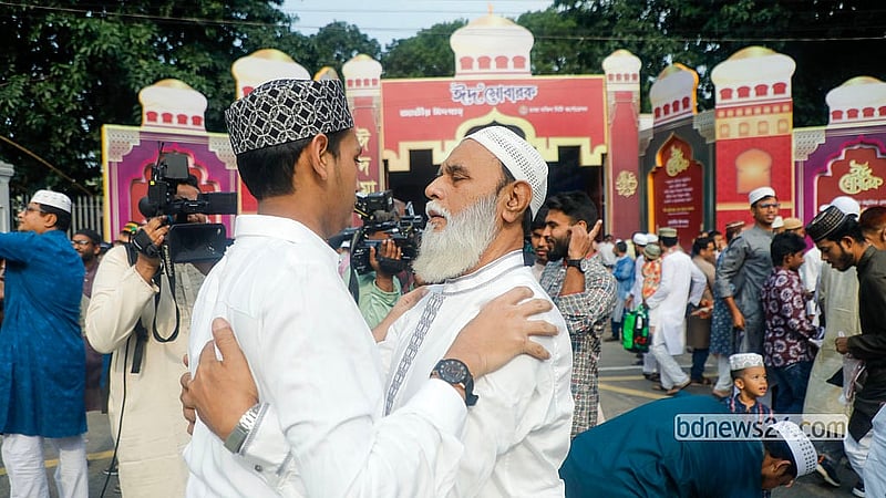 Embraces and greetings are exchanged after the Eid-ul-Azha prayers at the National Eidgah grounds on Thursday, May 28, 2026. Photo: Abdullah Al Momin