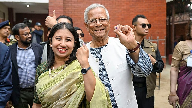 On election day, Muhammad Yunus and his daughter Dina Yunus show the indelible ink marks on their fingers after casting their votes at the Gulshan Model School and College centre. Photo: PID