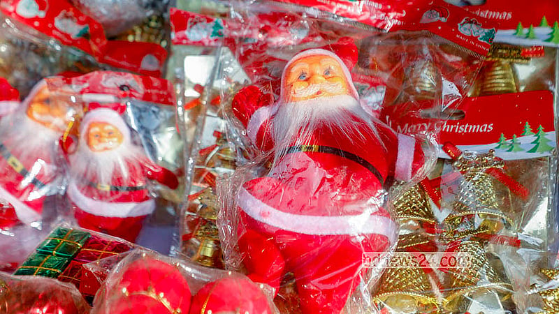 Shopkeepers sell Christmas decorations outside the Holy Rosary Church in Dhaka. Photo: Abdullah Al Momin