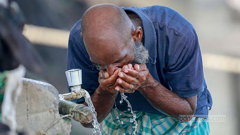 A labourer quenches the intense thirst spurred by the heat of a summer afternoon at a tap next to the road in Dhaka’s Gabtoli. Photo: Muhammad Mostafigur Rahman