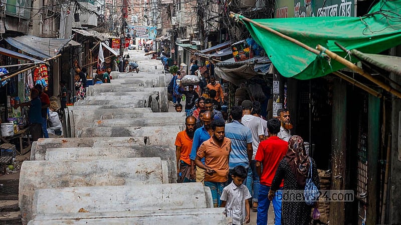 For the past 20 days, a big concrete pipe for the sewerage line has been on the road in Dhaka's Dayaganj Bazar. It takes up a lot of space, making it hard for pedestrians to walk. Photo: Mahmud Zaman Ovi