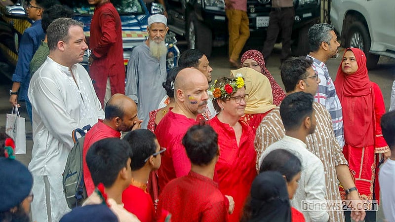 Foreign participants join the Baishakhi Shobhajatra to celebrate the Bengali New Year.  Photo: Abdullah Al Momin