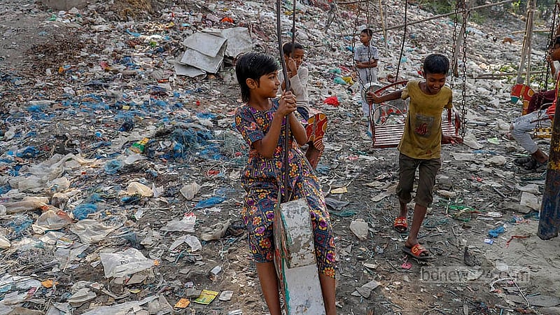 Children enjoy their time on a Merry Go Round in Dhaka’s Kamringarchar area, nestled along the banks of the soot black waters of the Buriganga River.Photo: Mahmud Zaman Ovi