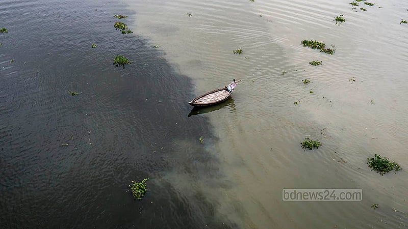 The river’s dark, inky water is visible year-round. But in the rainy season, it blends with new, cloudy water. Photo: Mahmud Zaman Ovi