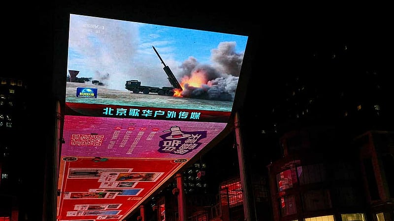 A giant screen shows a news report on China's &amp;quot;Justice Mission 2025&amp;quot; military drills around Taiwan, in Beijing, China December 30, 2025. REUTERS