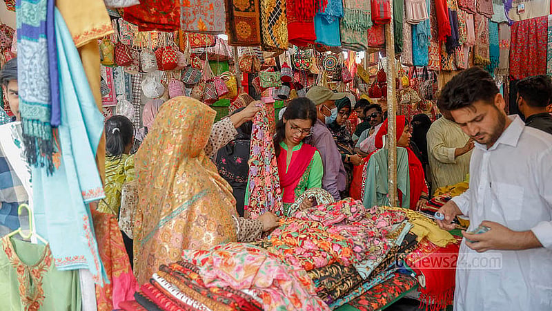 Visitors check fabrics at a Pakistani stall at the Dhaka International Trade Fair on Friday, Jan 30, 2026. Photo: Mahmud Zaman Ovi