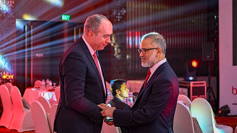 Editor-in-Chief Toufique Imrose Khalidi shares a moment with Kosovo’s Ambassador Lulzim Pllana at the 19th anniversary celebration of bdnews24.com at the Radisson Blu Water Garden Hotel in Dhaka on Thursday, Oct 23, 2025.