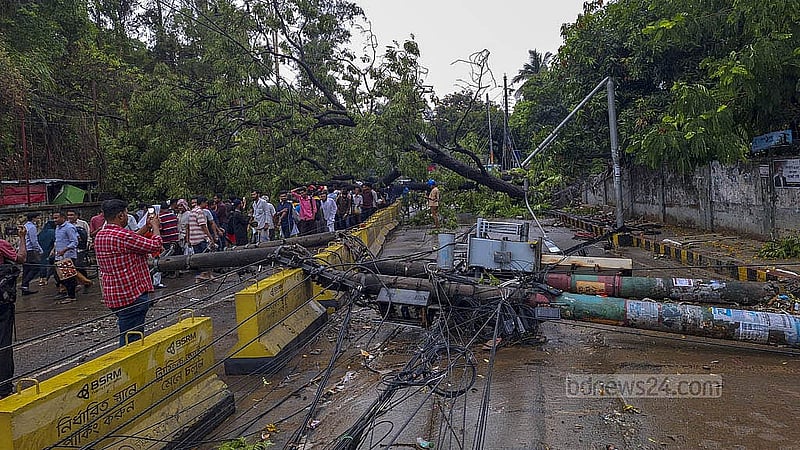 Storm uprooted electricity poles and trees on Zakir Hossain Road in Chattogram during a storm on Monday afternoon, May 6, 2024, bringing traffic in the area to a halt. Photo: Suman Babu