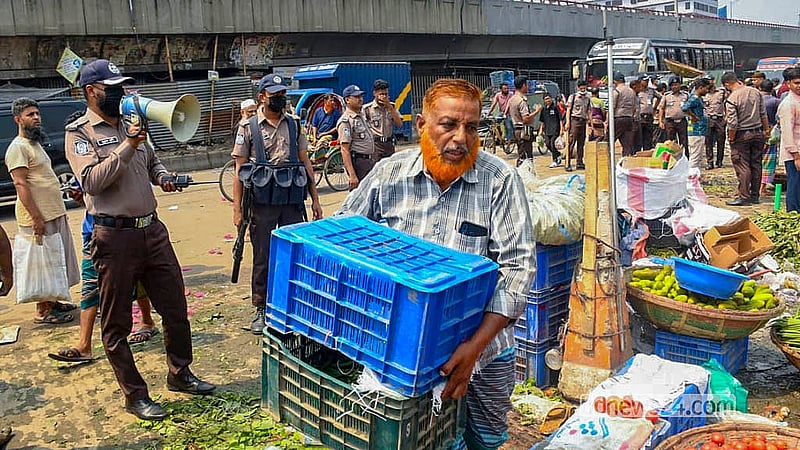 An eviction drive is under way to clear illegal structures from the road outside the Jatrabari wholesale market.