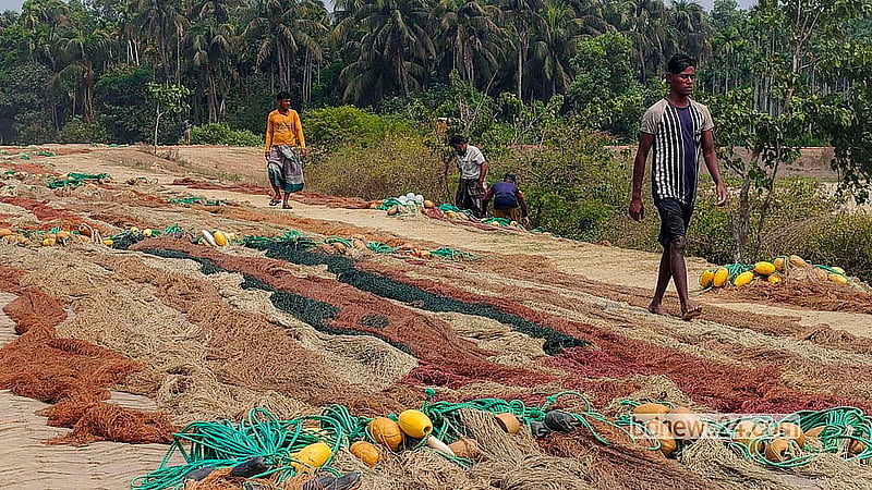 Fishermen dry their nets on Shah Porir Dwip in Cox’s Bazar’s Teknaf after returning to shore as a ban on sea fishing takes effect. Photo: Jashim Mahmud