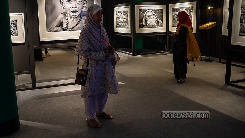 Female guests are exploring renowned Indian photojournalist Raghu Rai's solo exhibition 'Rise of a Nation' at the Zainul Gallery in Dhaka University's Faculty of Fine Arts. Photo: Mahmud Zaman Ovi