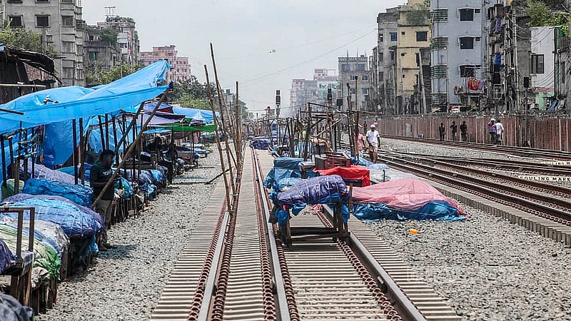 Hawkers in Dhaka’s Jurain are continuing to defy a ban on setting up shops on the railway tracks, forcing trains to run daily under risk. Photo: Abdullah al Momin
