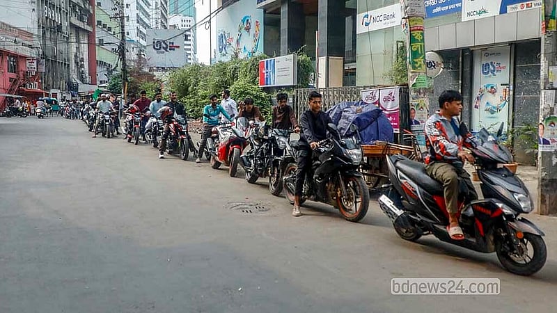 A long queue of motorcycles forms outside a filling station in Arambagh as riders wait to refuel on Monday, Mar 23, 2026. Photo: Abdullah Al Momin