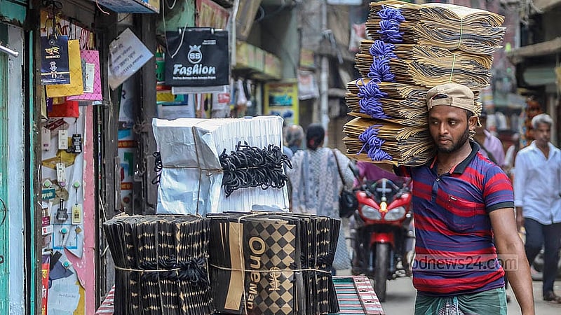Factory-made paper shopping bags have been brought to Syed Awlad Hossain Lane wholesale market in Dhaka’s Naya Bazar. Photo: Abdullah al Momin