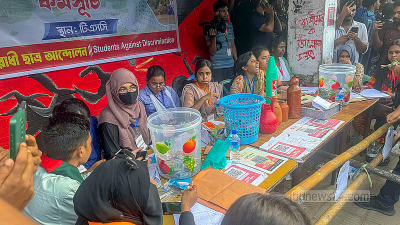 Volunteers set up a table on the left side of the entrance of the Teacher-Student Centre, or TSC, to collect cash donations, and the collected amount was noteworthy.