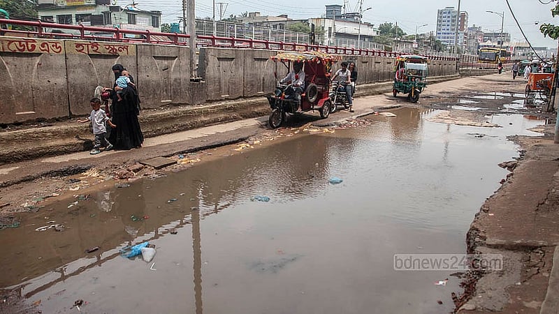 Large vehicles are not using the Dolai Par-Jatrabari road due to the huge potholes, some in the middle of the road. Photo: Abdullah Al Momin