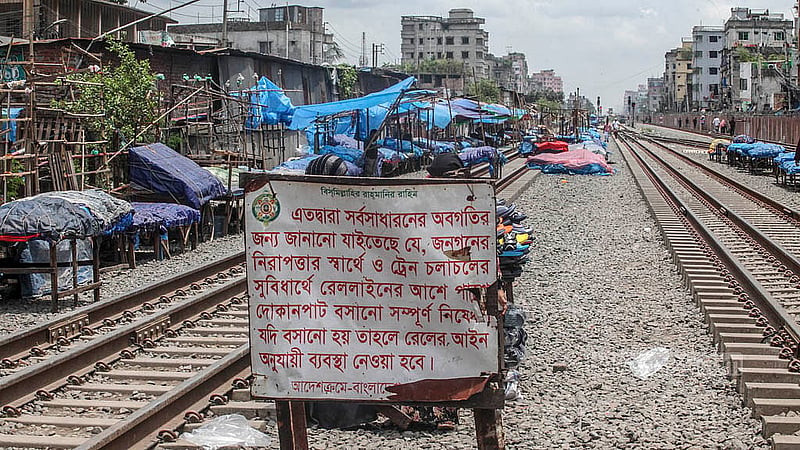Signboards have been put up along the roads in Dhaka’s Jurain, warning against setting up shops on the railway tracks to prevent accidents. Photo: Abdullah al Momin