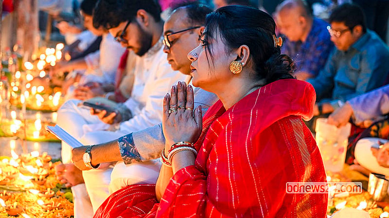 A female devotee prays during Rakher Upobash at the Swamibagh Loknath Ashram in Dhaka. Photo: Muhammad Mostafigur Rahman