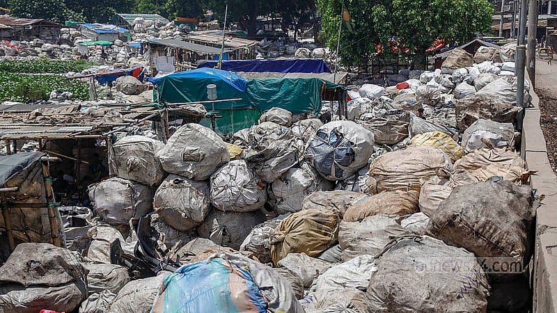Rows of white bags, stuffed with discarded plastics of every kind, line both sides of the road from the Buriganga’s original channel through West Islambagh in Old Dhaka. Photo: Mahmud Zaman Ovi