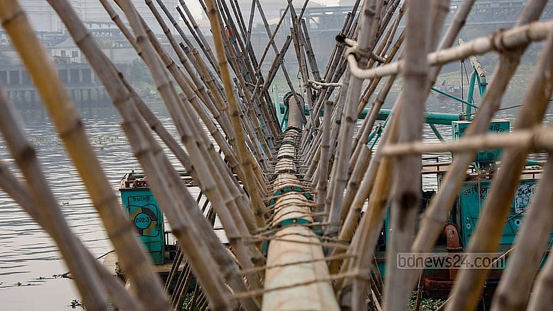 Rows of iron pipes are installed along the riverbank in the Munshikhola area of Shyampur, Dhaka, to pump sand from bulkhead vessels using dredgers. Photo: Mahmud Zaman Ovi
